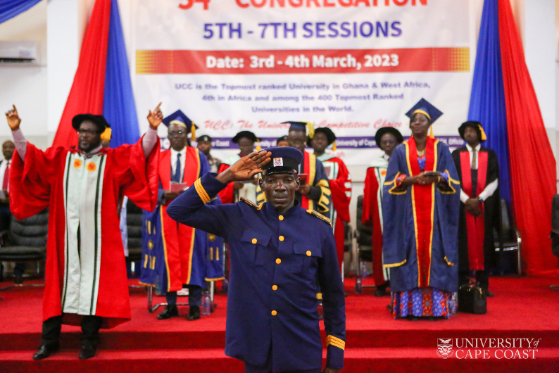 Security personel saluting while the congregation sings the UCC Anthem