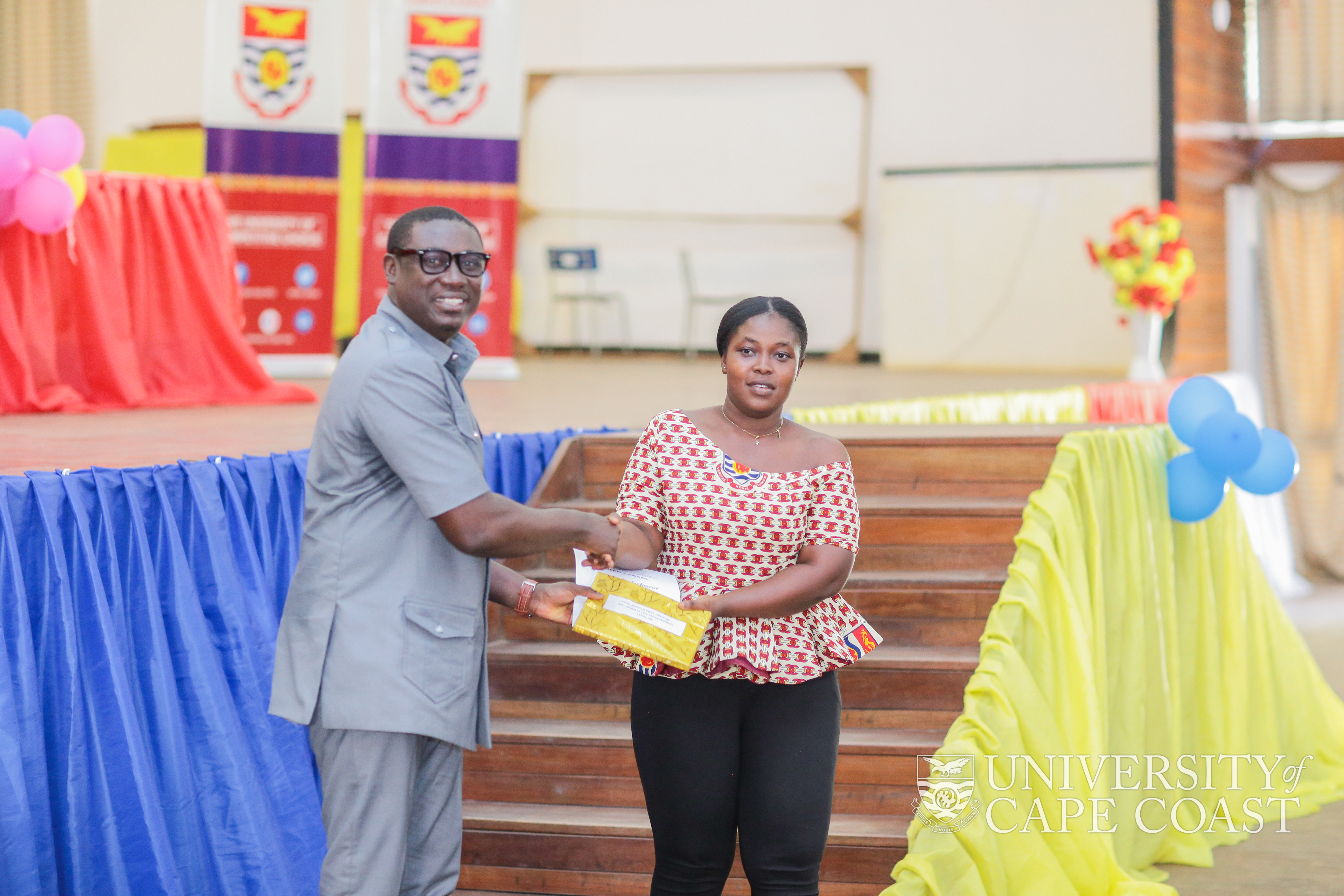 Mr. Franklin Owusu-Karikari presenting an award to a first class student