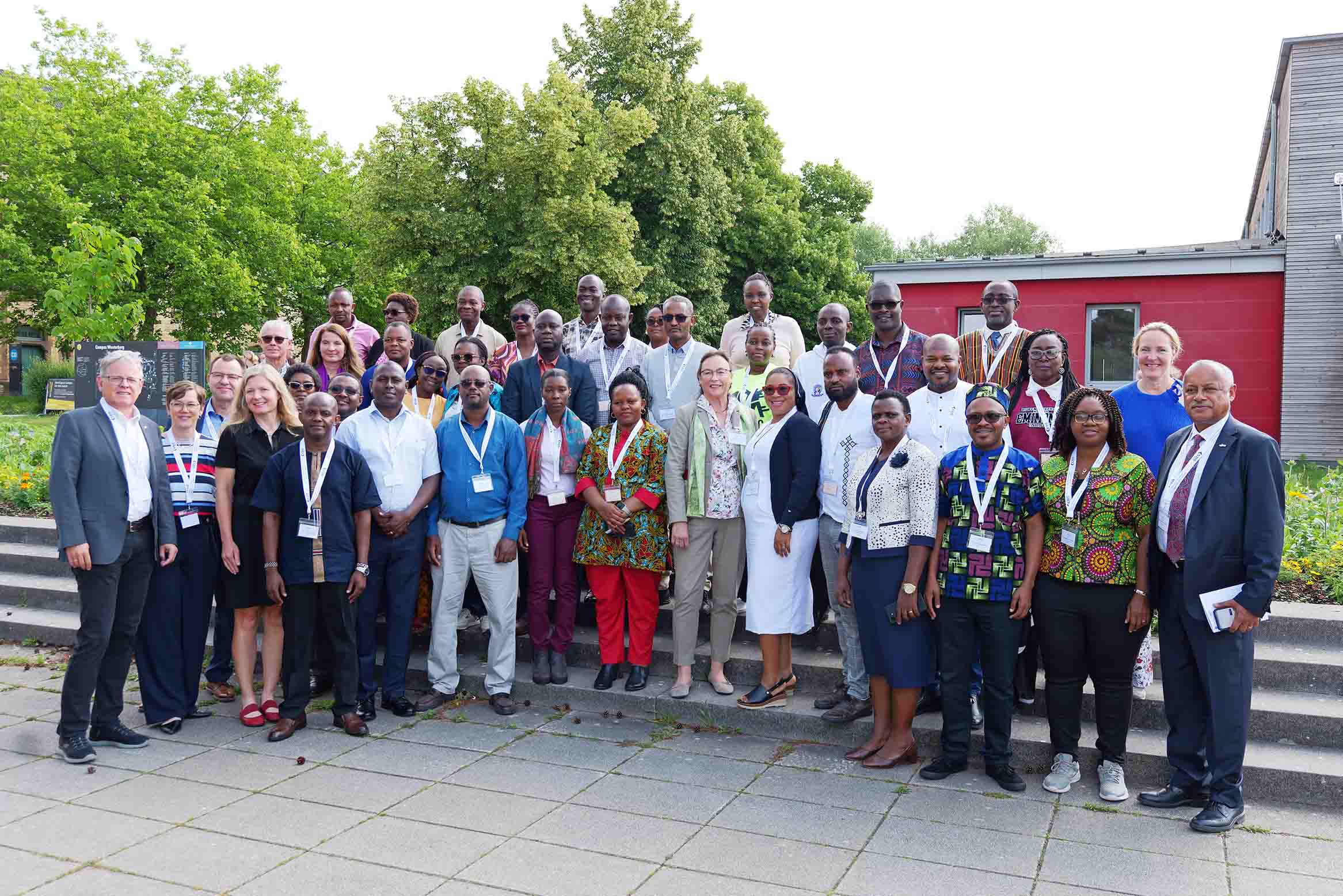 A group photograph of participants mentors organisers and funders in Germany