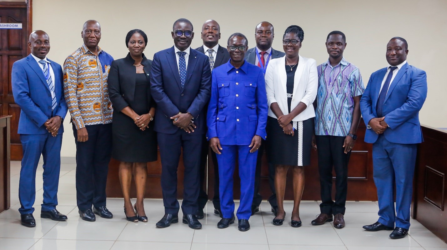 The MD of Prudential Bank (4th from left) and his team with the Vice-Chancellor (4th from right) and some management members of UCC