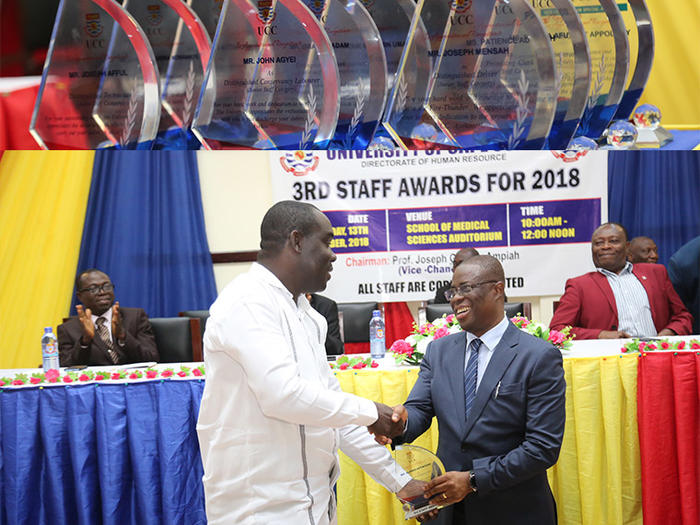 The Vice-Chancellor, Prof. Joseph Ghartey Ampiah presenting an award to a deserving staff