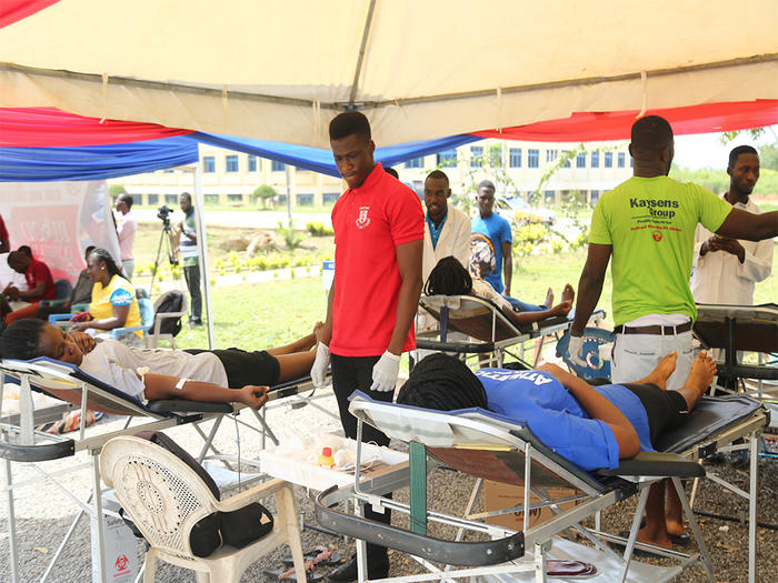 Some students donating blood at the programme