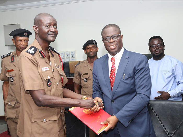 The Vice-Chancellor, Prof. Joseph Ghartey Ampiah, exchanging the signed MoU 