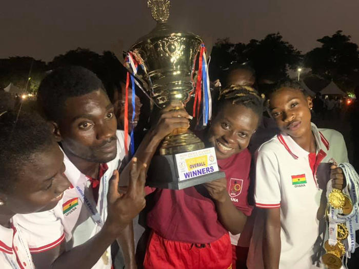 UCC students displaying the trophy