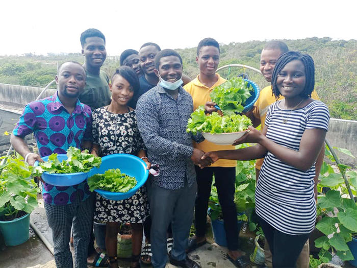 Students displaying their harvest