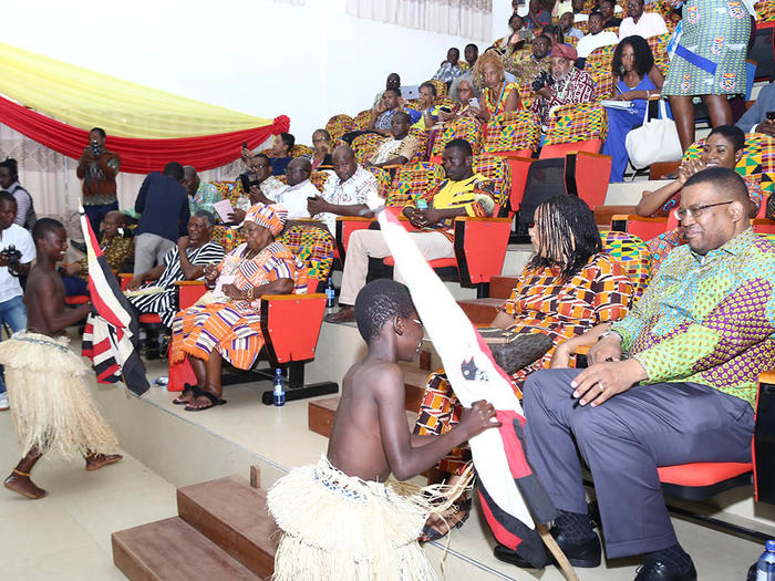 Participants admiring the traditional performance at the function