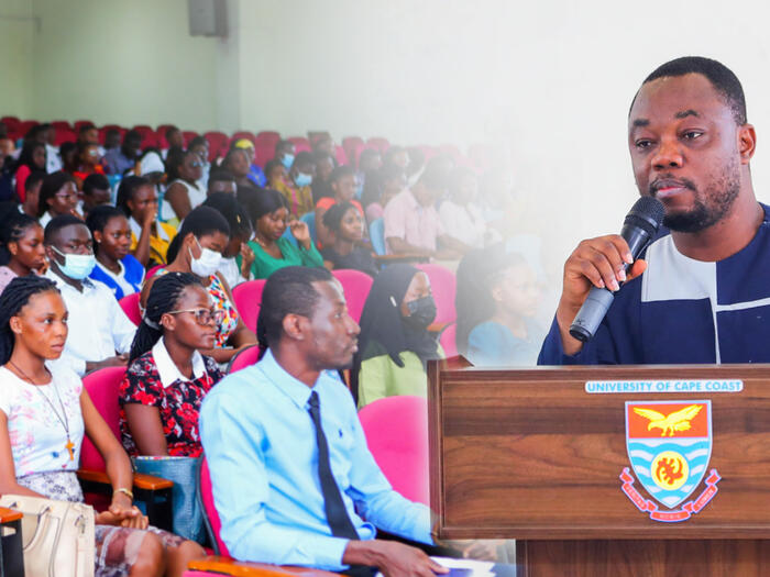 A man on a podium addressing a crowd