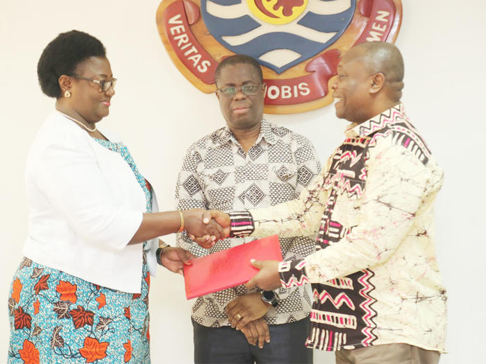 Prof. Dora Edu-Buandoh receiving the handing over notes from Prof. George K. T. Oduro New Pro Vice-Chancellor, Prof. Dora Edu-Buandoh receiving the handing over notes from Prof. George K. T. Oduro