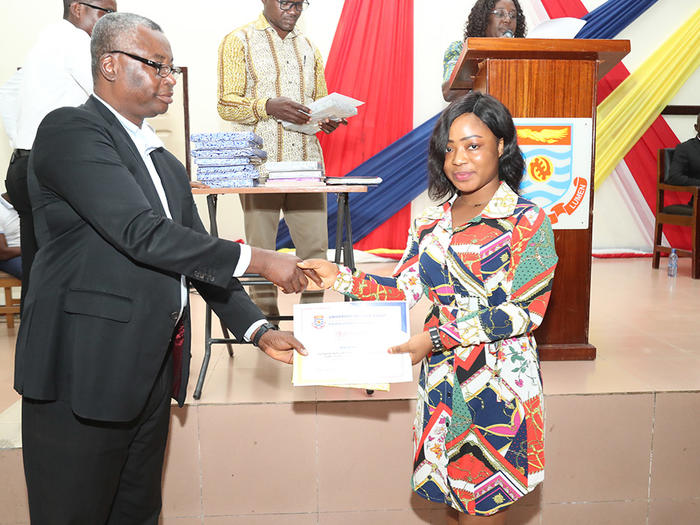 Prof. Amuquandoh presenting an award to a First Class student Prof. Amuquandoh presenting an award to a First Class student