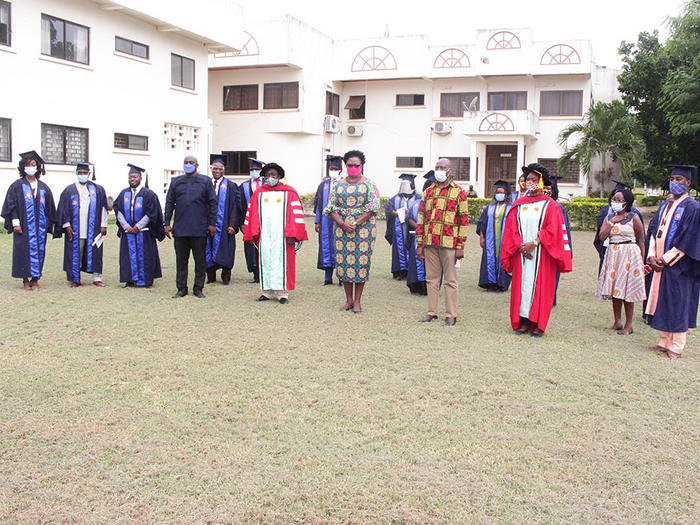 The graduates with the dignitaries