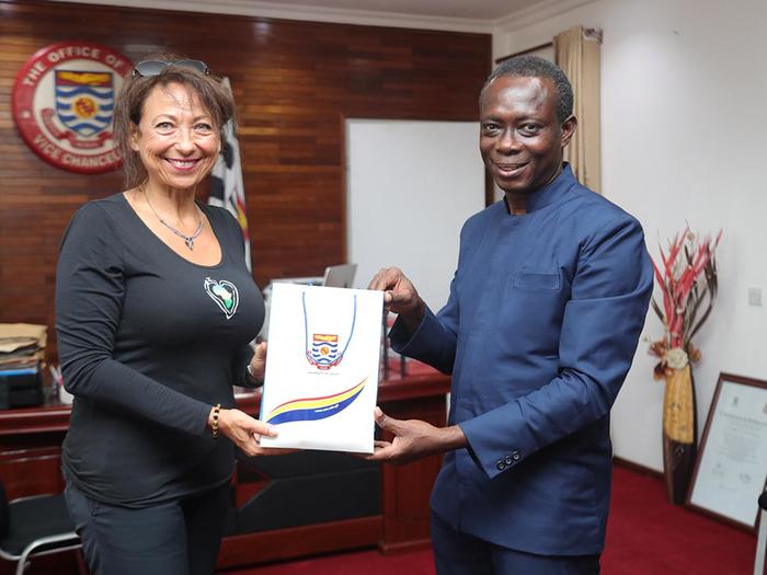 Prof. Boampong presenting a gift to Ms. Rubin 